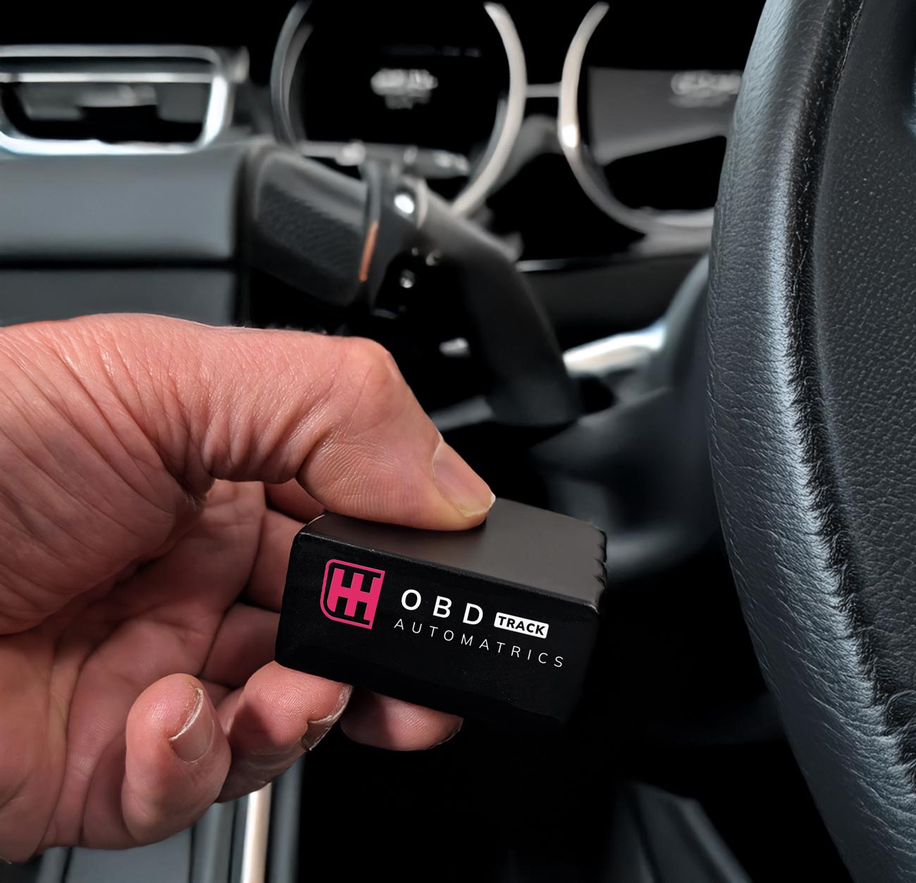 Automatrics-OBD-4G-Tracker-in-hand-in-car-c ODB II plug-and-go